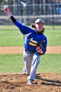 Mike Stiles hurls a pitch during his 13-strikeout performance for Comsewogue. Photo by Bill Landon