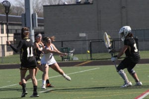 Ava Barry shoots past Commack’s goalkeeper for the good goal. Photo by Desirée Keegan