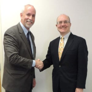 Robert Fenter, left, is welcomed as the new Superintendent of the Cold Spring Harbor Central School District by board of education President Robert C. Hughes. Photo from Cold Spring Harbor Central School District