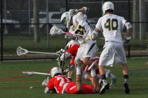 Smithtown's Luke Eschbach dives for the ball to beat out Ward Melville players. Photo by Desirée Keegan