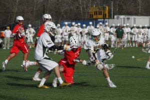Ward Melville's Liam Davenport leads the chase for the ball at midfield. Photo by Desirée Keegan