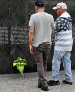 Jon Stewart and John Feal observe the wall of heroes at the 9/11 Responders Remembered Park. Photo from John Feal