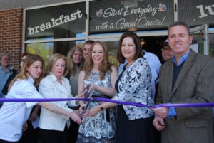 Staff members cut the ribbon at the opening of Cause Café. Photo from Stacey Wohl