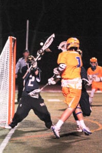 Trevor Kennedy scores to the top right corner past a reaching goalkeeper. Photo by Bill Landon