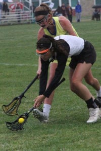 Shannon Savage scoops up a ground ball. Photo by Desirée Keegan