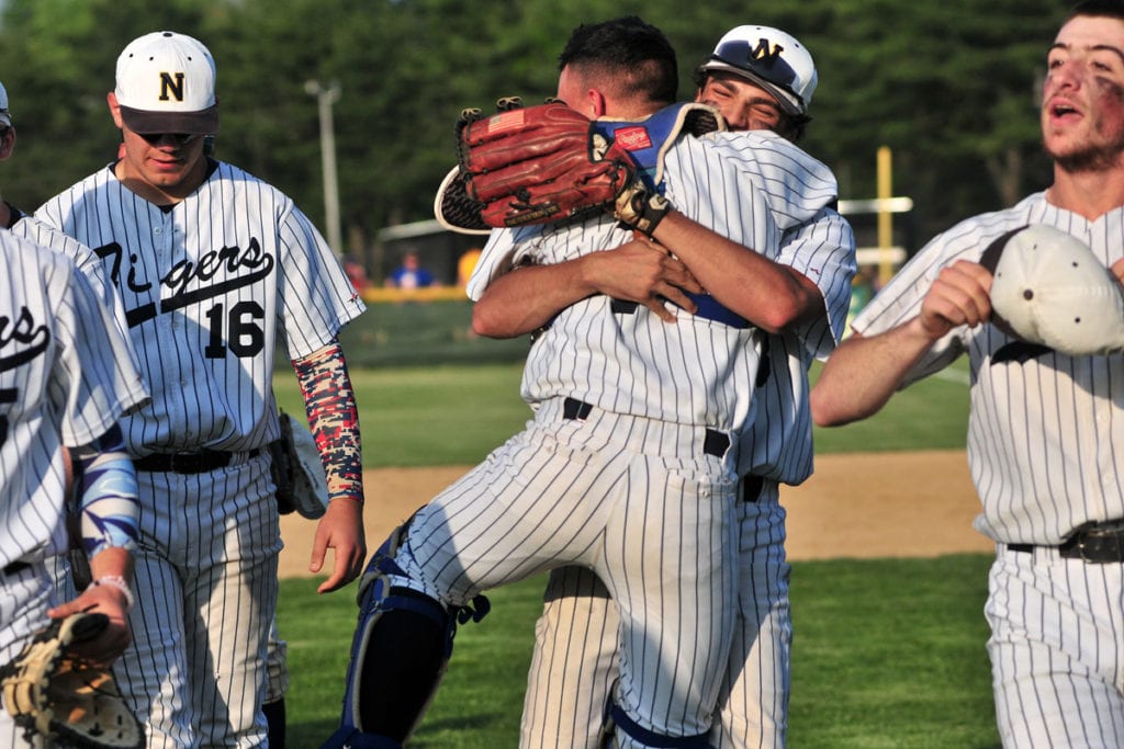 Northport players hug it out in celebration of their7-0 Class AA semifinal win over Smithtown West that will send them to the Suffolk County finals. Photo by Bill Landon