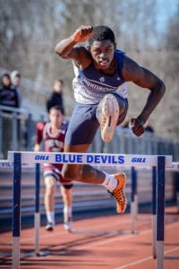 Infinite Tucker competes in the 400-meter intermediate hurdles at the state qualifier. Photo by Darin Reed