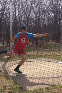 Liam Hendricks winds up to hurl the discus. Photo from Kathie Borbet
