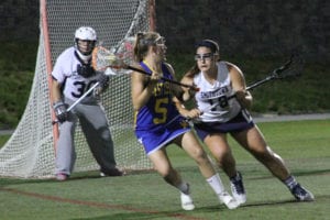 Jessica English defends against a West Islip attack. Photo by Desirée Keegan