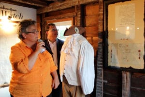 Mayor Margot Garant discusses the new historic letter mounted on the wall at the Drowned House Cottage museum in Port Jefferson. Photo by Giselle Barkley
