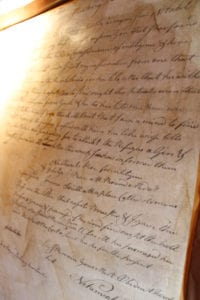 A historic letter detailing the involvement of Port Jefferson brothers in George Washington's Culper Spy Ring is on display at the Drowned Meadow Cottage. Photo by Giselle Barkley