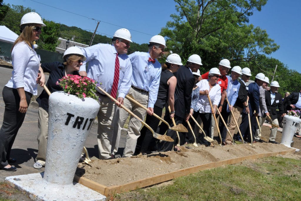 Port Jefferson officials shovel some dirt at the groundbreaking for the Shipyard apartments on June 14. Photo by Elana Glowatz