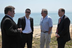 U.S. Rep Lee Zeldin, far right, listens during his visit to Plum Island. Photo from Zeldin's office.