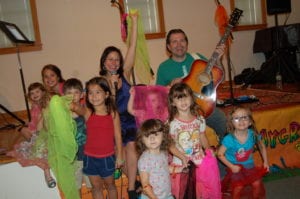 Children enjoy a concert with Aly Sunshine and Johnny Wheels of Funky Town Playground at Family Fun Day at the LIM