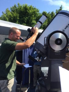 Dave Bush keeps an eye on the sun with the new Vanderbilt solar telescope. Photo courtesy of the Vanderbilt Museum