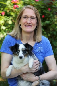 Above, the author with her dog Pepper, a mini Australian shepherd. Photo courtesy of Cindy Sommer