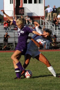Jillian Colucci fights for possession of the ball. Photo by Desirée Keegan