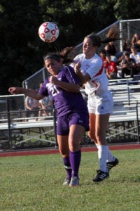 Mikayla Yannucci heads the ball out of Port Jefferson’s zone. Photo by Desirée Keegan