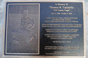 A memorial plaque rests in front of the extrance to the gate of the new Thomas Cutinella Memorial Field. Photo by Bill Landon