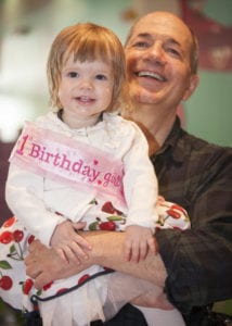 Ivan Bozovic with his granddaughter Vivien at Vivien’s first birthday party last year in California. PhotoPhoto by Julie Hopkins, cameracreations.net