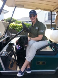 Ret. Navy Lt. Melanie Monts de Oca and her service dog Liberty smile at the golf fundrasier in Huntington. Photo by Sara Ging