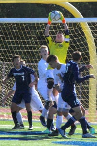 Smithtown West's Aaron Siegel makes a leaping save in the Bulls' shutout of Huntington. Photo by Desirée Keegan