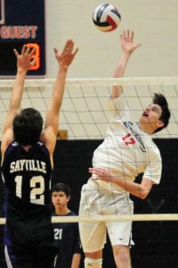 Outside hitter Kevin Kelleher comes through with a kill shot. Photo by Bill Landon