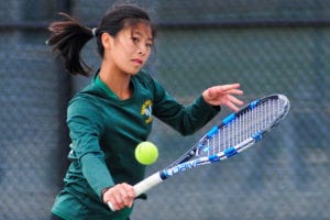 Denise Lai continues the volley. Photo by Bill Landon