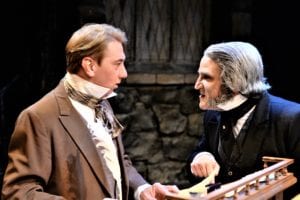 Douglas J. Quattrock as Bob Cratchit & Jeffrey Sanzel as Scrooge in a scene from 'A Christmas Carol'. Photo by Brian Hoerger, Theatre Three Productions, Inc.