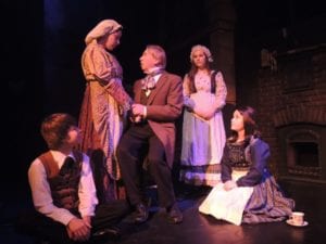 From left,The Cratchit family, sans Tiny Tim, from left, Jace Rodrigues, Marquez Stewart, Douglas Quattrock, Zoe Kahnis and Kellianne Crovello in a scene from last year’s ‘A Christmas Carol’. Photo from Theatre Three
