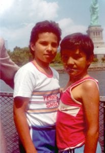 Harold Fernandez, left, with his brother Byron with the Statue of Liberty in the background. 