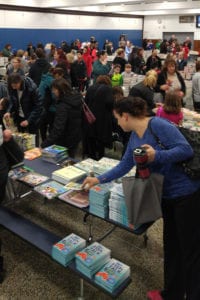  Hundreds of students, families and members of the community lined up to look through more than 15,000 books donated by the Middle Country Teachers Association. Photo from Middle Country school district