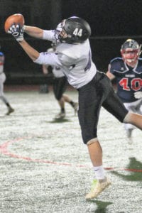 Port Jefferson's Brian Mark makes a leaping catch. Photo by Bill Landon