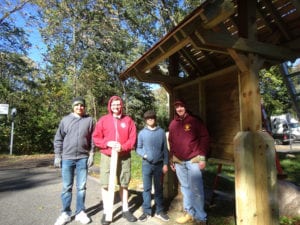 From left Marc Difilippo, Jake Linkletter, AJ Colletta and David Linkletter install a new kiosk on the Setauket end of the trail. Photo by Nick Koridis