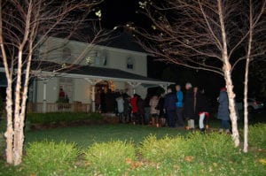 Visitors wait to enter one of the homes on the tour. Photo by Heidi Sutton