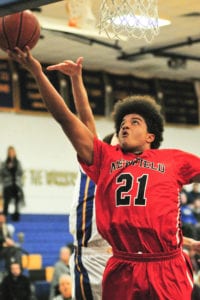 Newfield's justin Ottenwalder scores a layup. Photo by Bill Landon