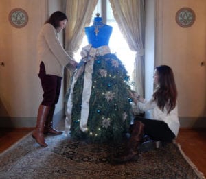 Mary Schlotter (left) and Krishtia McCord of Harbor Homestead & Co. Design in Centerport create a Christmas dress for Rosamund Vanderbilt in her dressing room. Photo from Vanderbilt Museum